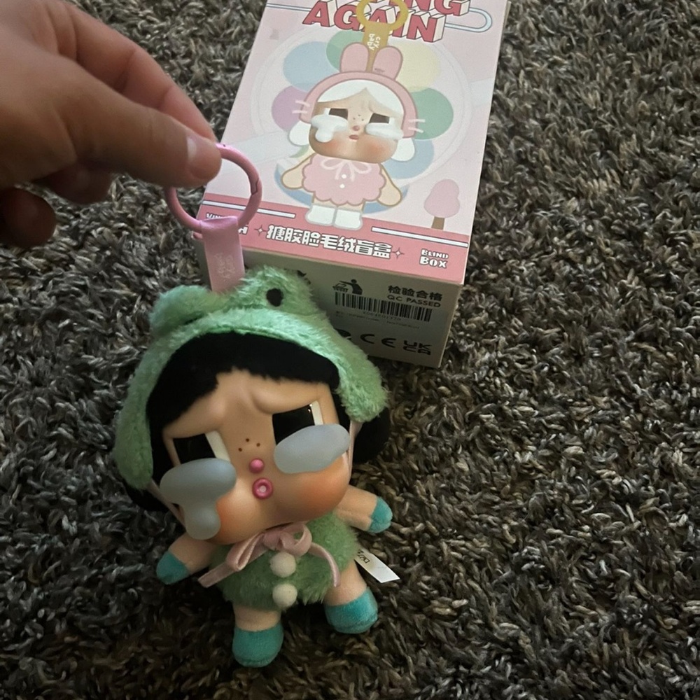Green and Pink Plush Doll with Expressive Features